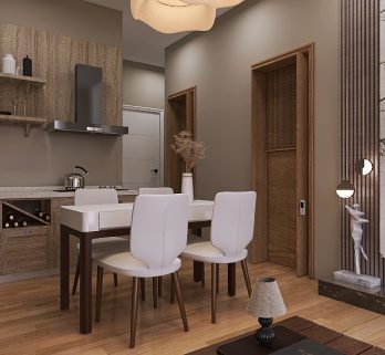 Moderna cucina e zona giorno con pavimento in legno. La cucina ha mobili in legno chiaro, una stufa e un bollitore. La zona giorno è caratterizzata da una parete decorativa in marmo con una TV, un camino decorativo luminoso e un tavolo con sedie bianche.